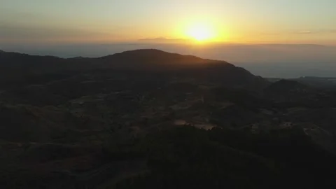 Sun setting over volcanic landscape and Teide Volcano Stock Footage 315131727