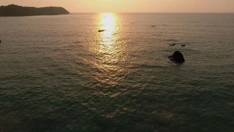 Sun setting over a waterbody Stock Footage 111702773