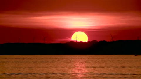 Sun setting past the horizon Stock Footage 155822238
