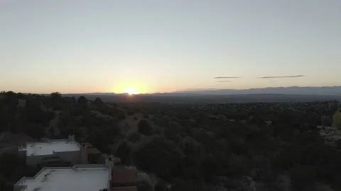 The sun is setting right on the horizon of a vast desert landscape Stock Footage 167673458