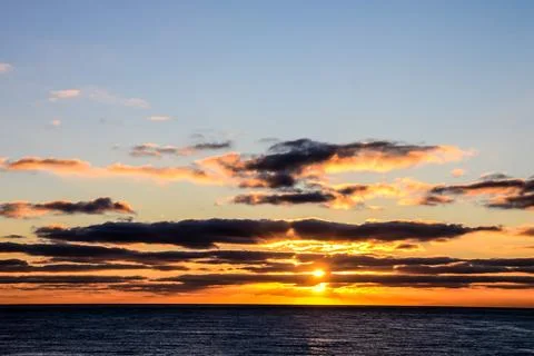 The Sun Setting in the Sea Stock Photos