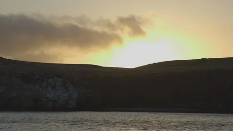 Sun Setting on Sea Wall Coast of Santa Cruz Island Stock Footage 121526921