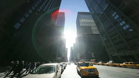 The Sun, Shadows, and Convoys Moving Above the Skyscrapers Stock Footage 327278896