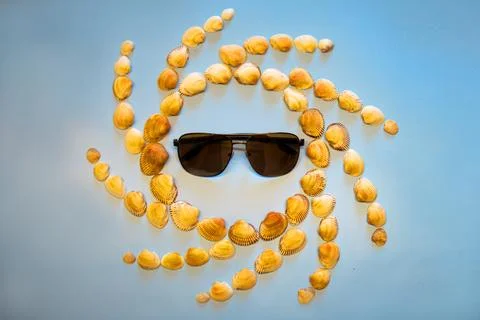 Sun of shells in sunglasses Stock Photos