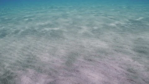 Sun shine and sun beams fall on sandy bottom creating light pattern on it Stock Footage 252016427