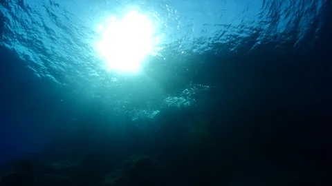 Sun shine sun beams and rays scuba divers underwater Video stock 105212230