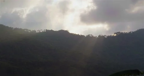 Sun shine through the clouds and fog over the mountains and the forest, Thailand Stock Footage 234868350