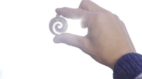 Sun shine through pendant close up 4K Stock Footage 58207656