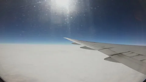 The sun shines brightly as the plane soars above the sea of clouds 스톡 동영상 146314742