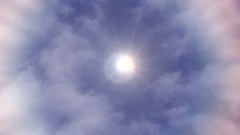 The sun shines brightly, seen between clouds  Stock Footage 158910543