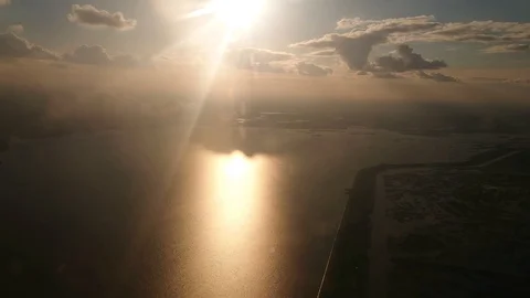 The sun shines frontally into the camera, the river sparkles, the shooting from Stock Footage 107829592