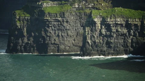 Sun shines on Irish Cliffs of Moher Stock Footage 169901697
