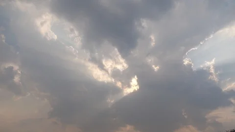 The sun shines out from the white clouds. 動画素材 107259561