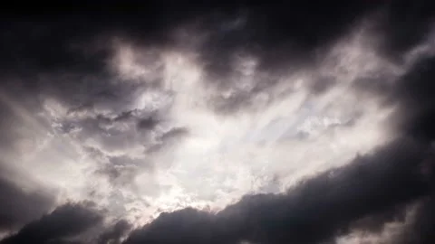 The sun shines through the black clouds.time lapse 動画素材 145740383