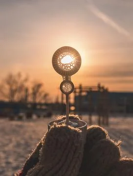 The sun shines through a circle in a soap bubble stick Stock Photos