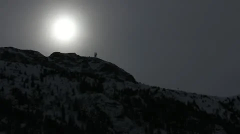 Sun shines through the clouds above a mountain Video stock 21651247