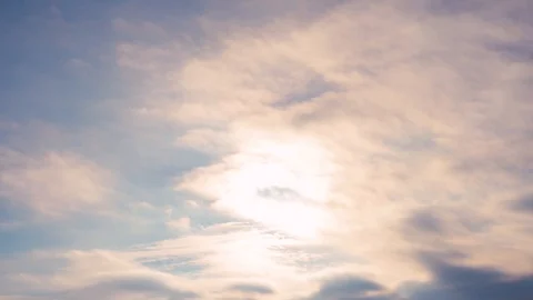The sun shines through the clouds on a blue background Video stock 102605747