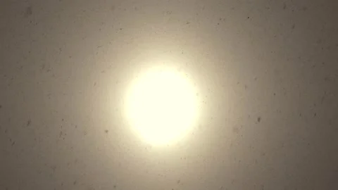 Sun shines through clouds during heavy snowing during blizzard Stock Footage 331762398