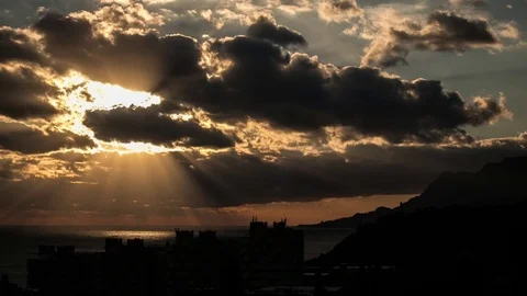 Sun Shines Through Clouds epic timelapse. Time Lapse Of Dark Storm Clouds 스톡 동영상 83450462