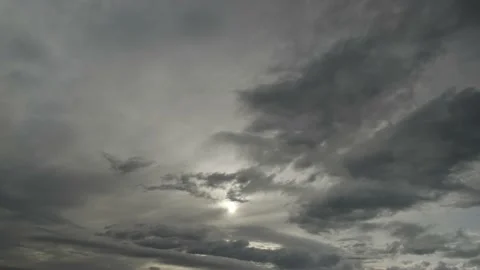 The sun shines through the clouds flying quickly. Stock Footage 142759842