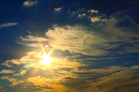 The sun shines through the clouds Stock Photos