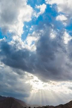 Sun shines through clouds Stock Photos