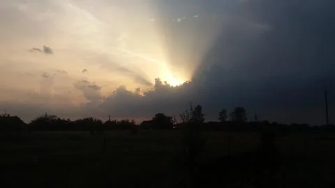 The sun shines through the clouds Stock Photos