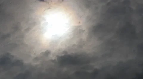 Sun shines through the dark clouds moving forward time lapse Stock Footage 49927219