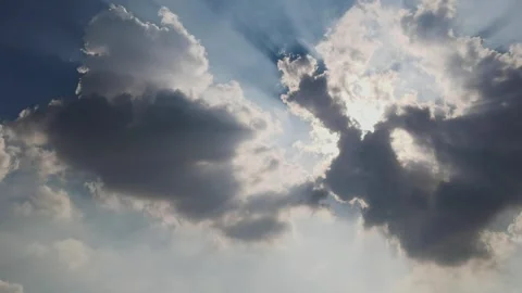 The sun shines through the dark clouds in the sky Stock Footage 247958450