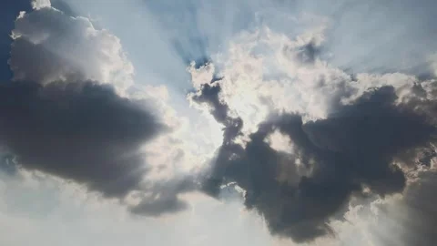 The sun shines through the dark clouds in the sky Stock Footage 247958452