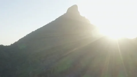 Sun shines through Sacred Summit, Australia, QLD, Gondwana, Wollumbin Stock Footage 236514322