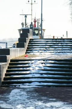 The sun shines through the steps of a staircase Stock Photos