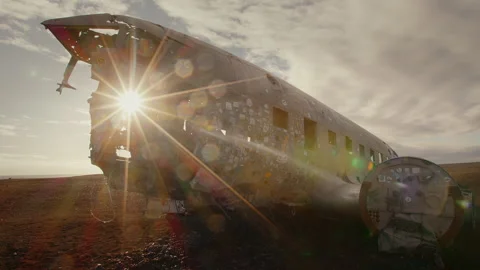 Sun shines through the window of a plainwreck, flair, entire plain, Iceland, Sol Stock Footage 260952460