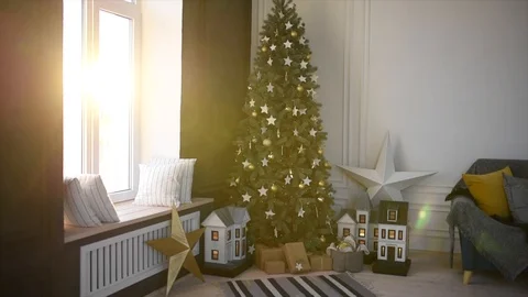 The sun shines through the window of the room with a Christmas tree Stock Footage 120142706