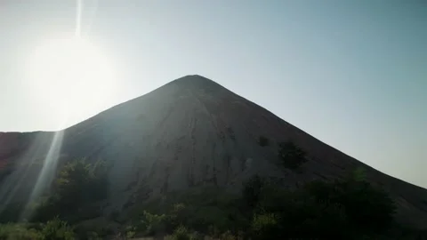 The sun shines on top of a high mountain 4K Stock Footage 204977367