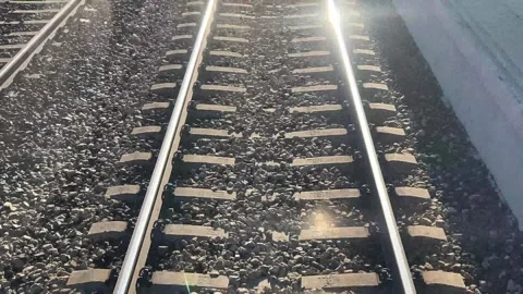 The sun shines on the train tracks Stock Footage 313220131