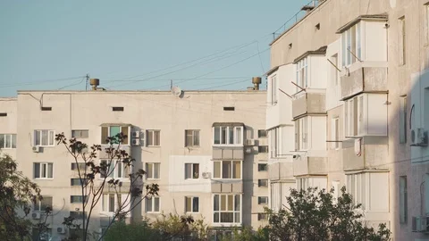 The sun shines on the windows of a big house Stock Footage 107543653