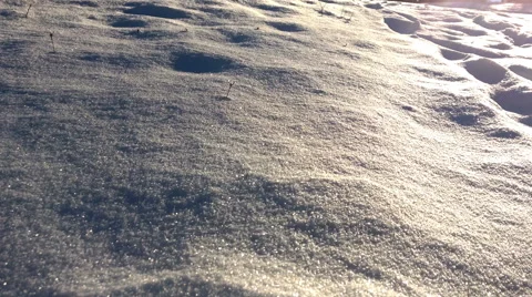 Sun shines on winter snow surface Stock-Footage 65015131