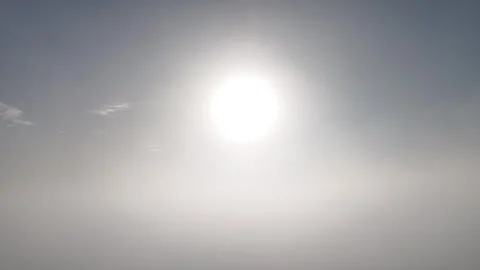 Sun Shining Above Cloud Layer and Blue Sky in 4K Видео 337539082