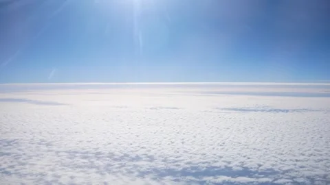 Sun Shining Above Clouds in Sky Stock Footage 268503748