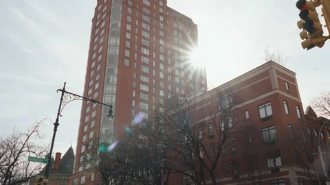 Sun shining from behind the big buildings in New York Stock Footage 236654428