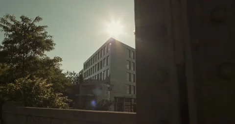 Sun shining behind the buildings Stock Footage 221846413
