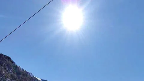 Sun shining in between the mountains, Pov Driving In The Middle Of The Mountains Stock Footage 159633285