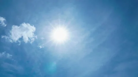 Sun shining in blue sky with clouds movement Stock Footage 142676291