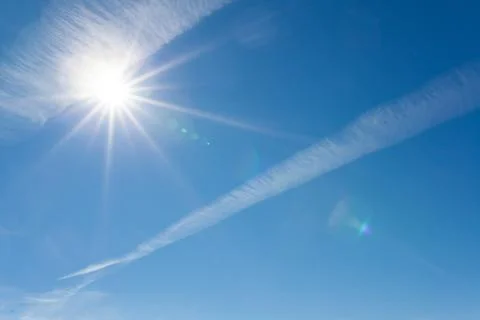 Sun shining blue sky Stock Photos