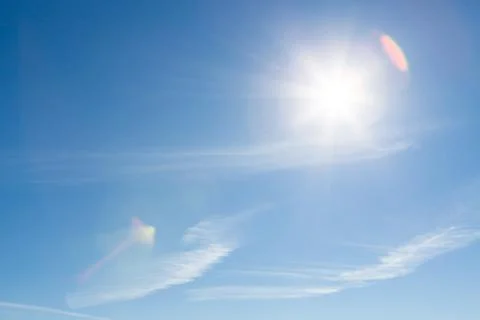 Sun shining blue sky Stock Photos