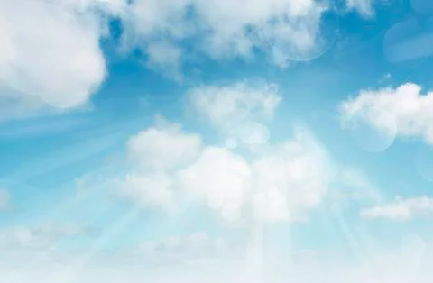 Sun shining in clouds Stock Photos