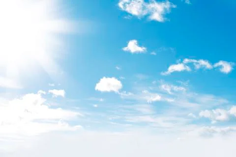 Sun shining in clouds Stock Photos