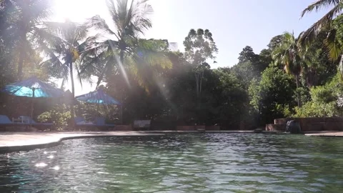 Sun shining down onto clear empty pool Stock Footage 170260099