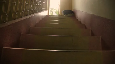 The sun is shining at the gate through the stairs of the house Stock Footage 156182590